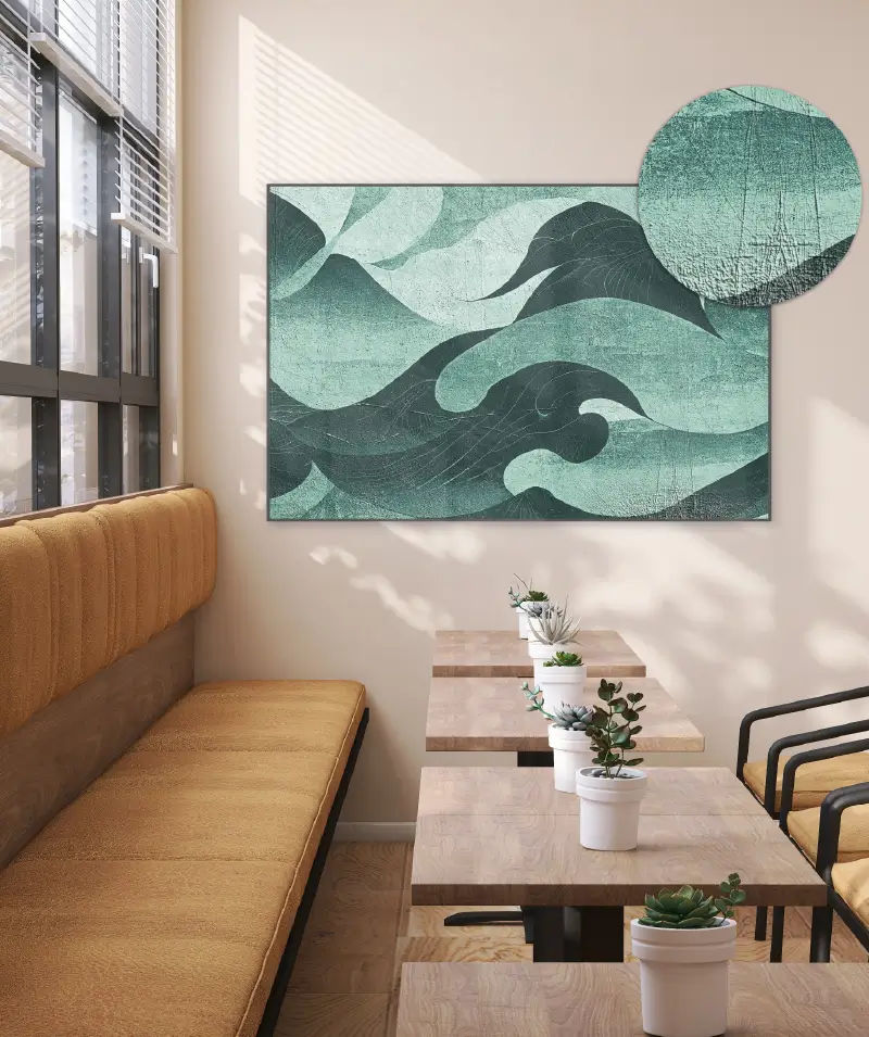 Textured canvas artwork with embossed teal wave design displayed in a modern café interior, showcasing the DA-640 printer’s ability to add depth and dimension to fine art prints