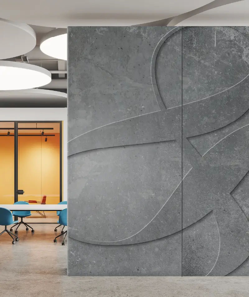Embossed logo motif on textured concrete wall printed with DA-640, demonstrating digital embossing capabilities on hard surfaces for modern interior branding and architectural design