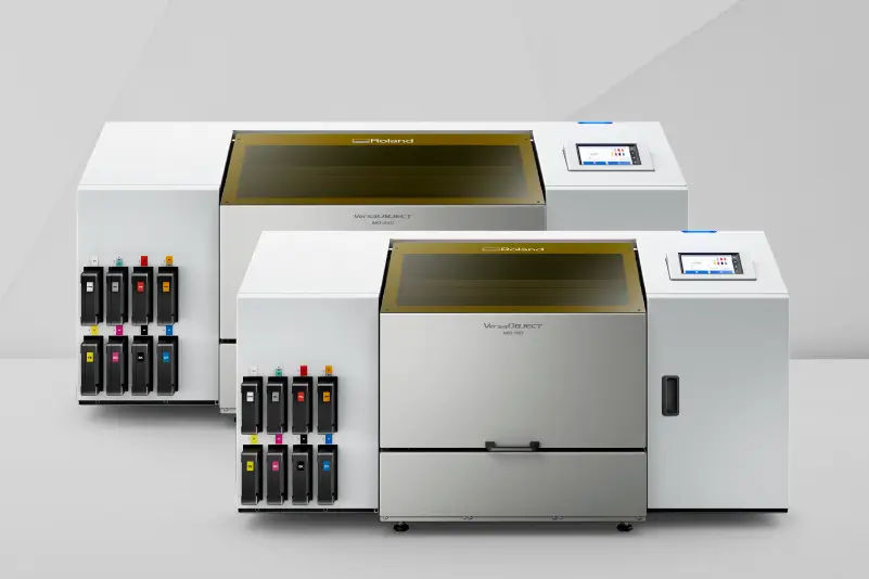 A Roland-certified engineer working on a printer