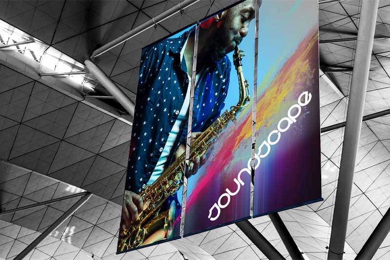 Large printed banner hanging from a ceiling