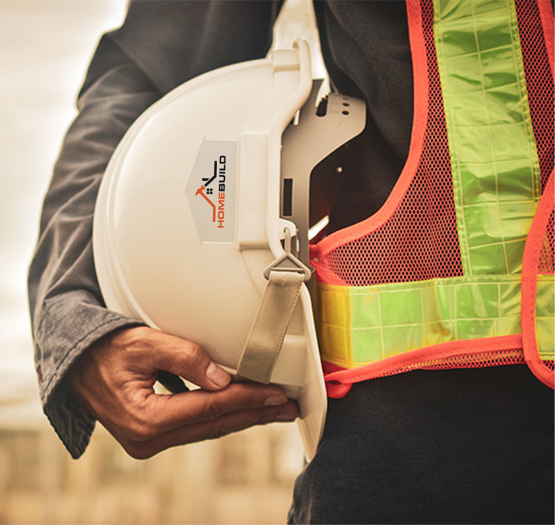 A person holding a helmet with company logo 