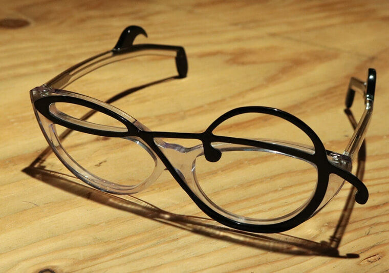 Bespoke eyewear featuring a musical note made from two layers of resin material