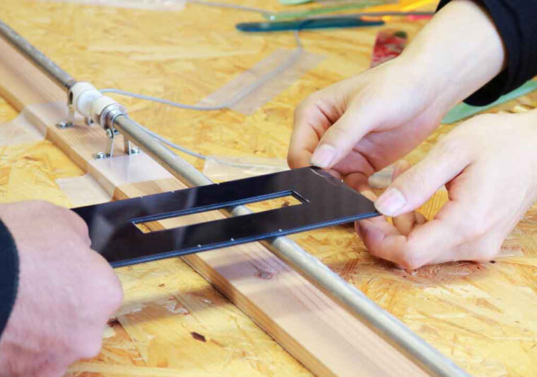 Acrylic can easily be bent to shape to create a personalised mobile phone holder