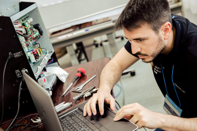 service engineer working on a laptop