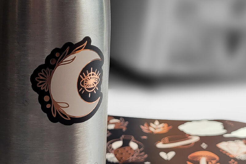 A sticker printed on metallic vinyl on a water flask