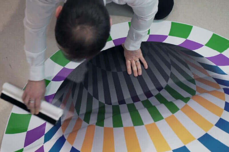 Applying a floor graphic sticker