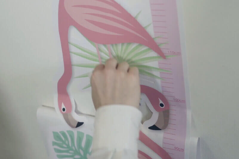 Applying a wall sticker in the home