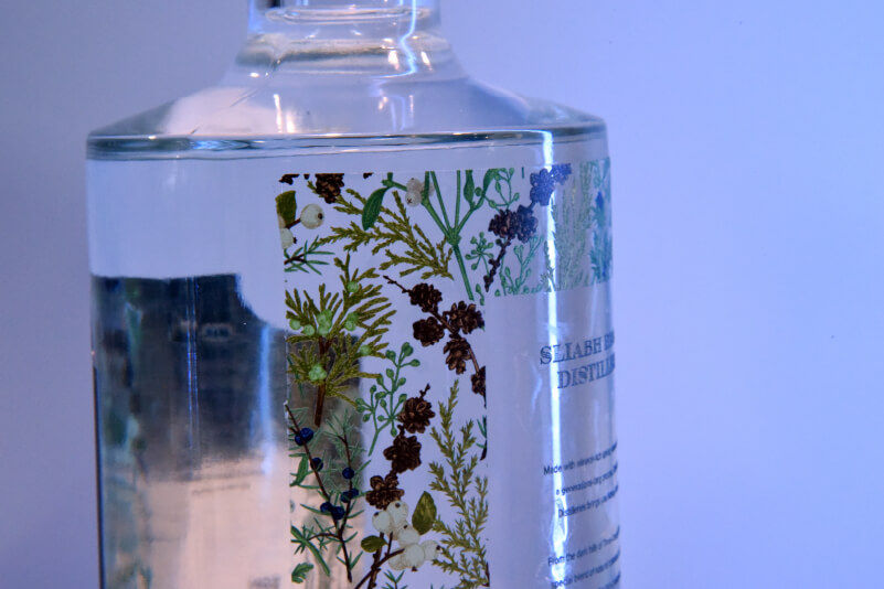 Semi-transparent label on the back of a gin bottle