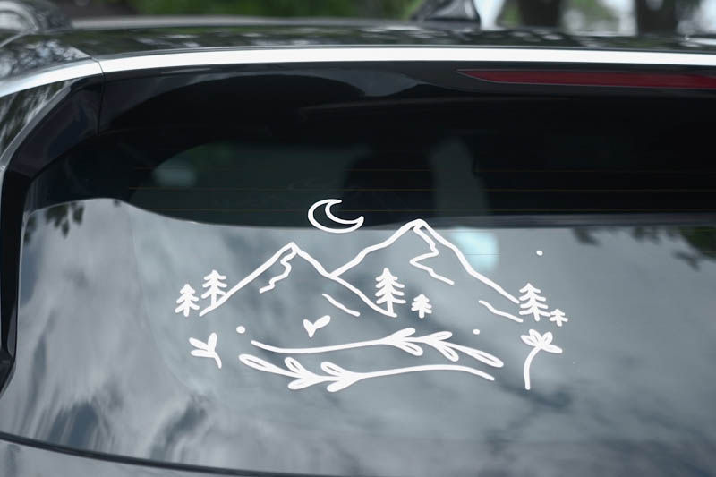 A mountain scene car window sticker