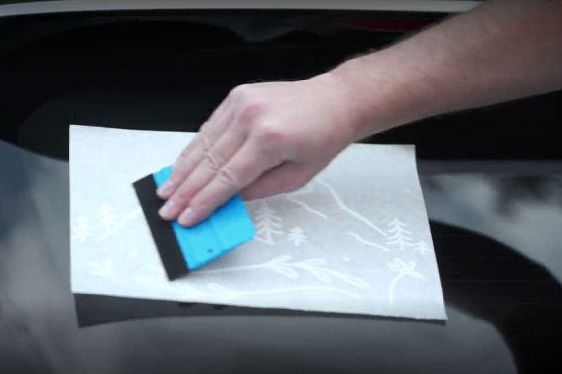 Applying a sticker to a car window