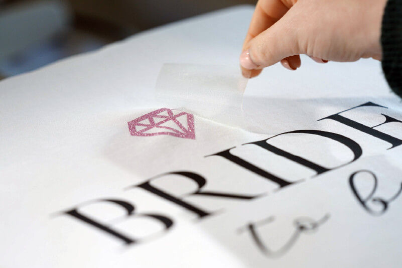 Removing the backing sheet from a HTV T-shirt design