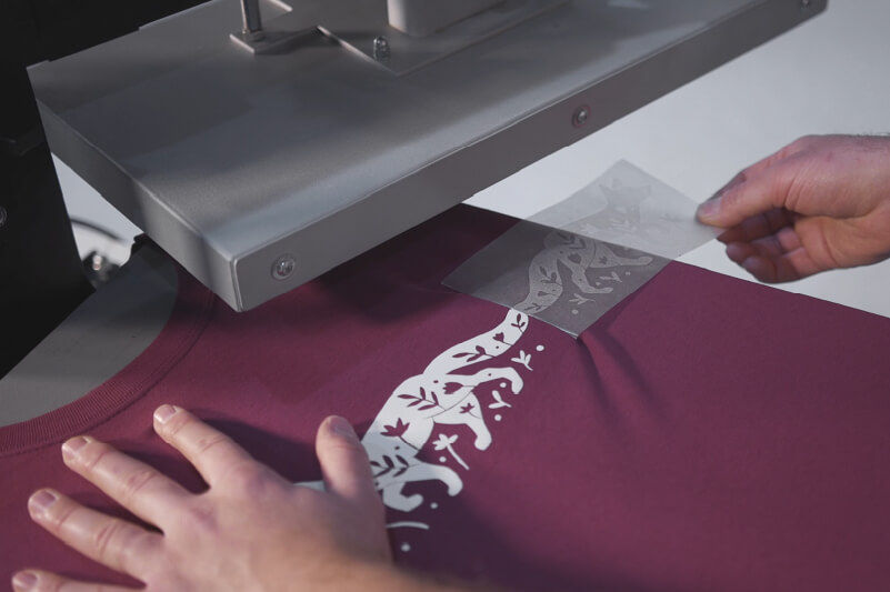 Removing the backing sheet after the design has been pressed