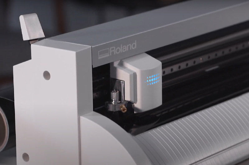 A close up of the GS2-24 vinyl cutter in action