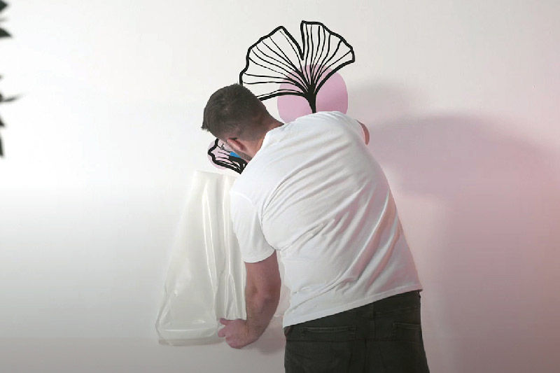 Removing the application tape from the wall