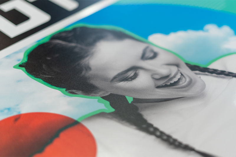 A close up of a face on a large format print