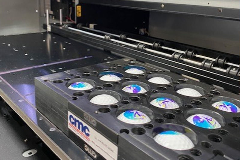 Printed golf balls on a jig