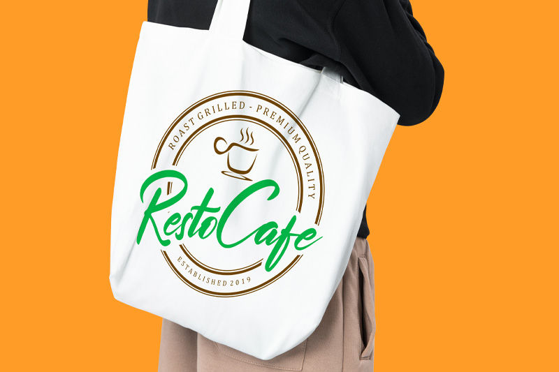 A person holding a white tote bag