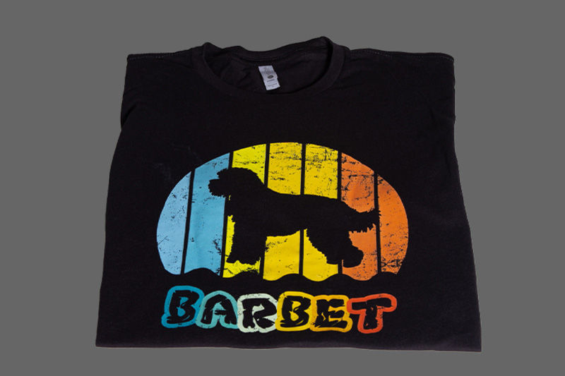 A black shirt with a dog on it after being printed with DTF