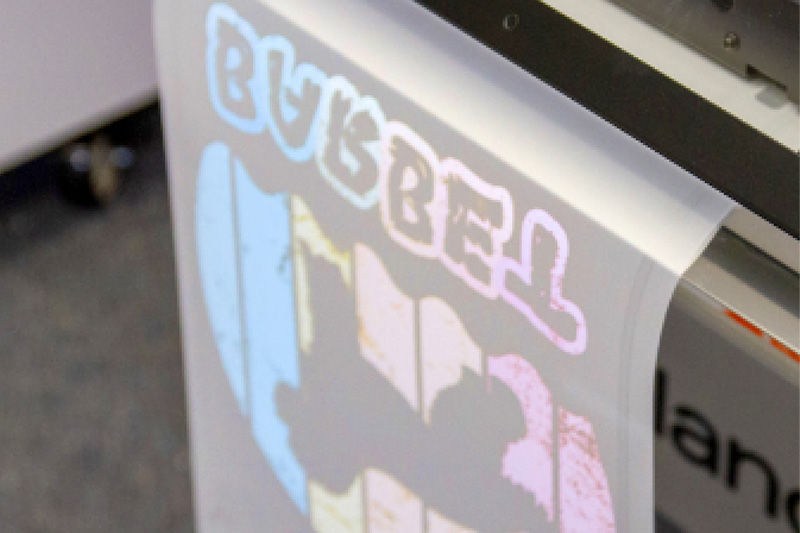 Print to film with a DTF printer on transfer film.