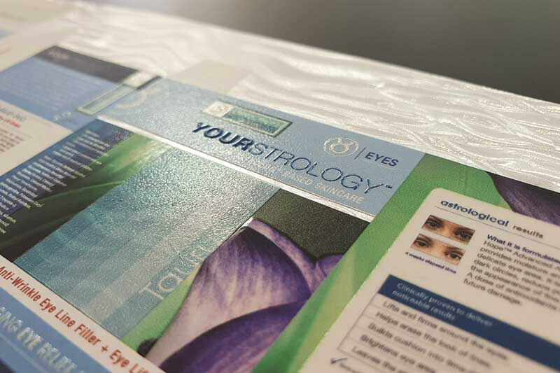 Embossed text simulated with gloss UV ink on packaging mock-up