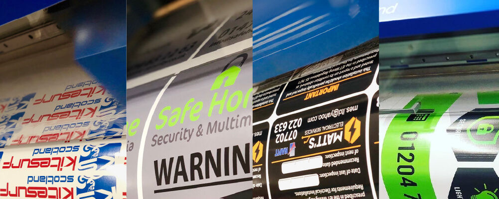 The Vinyl Guys various labels being printed on a printer cutter