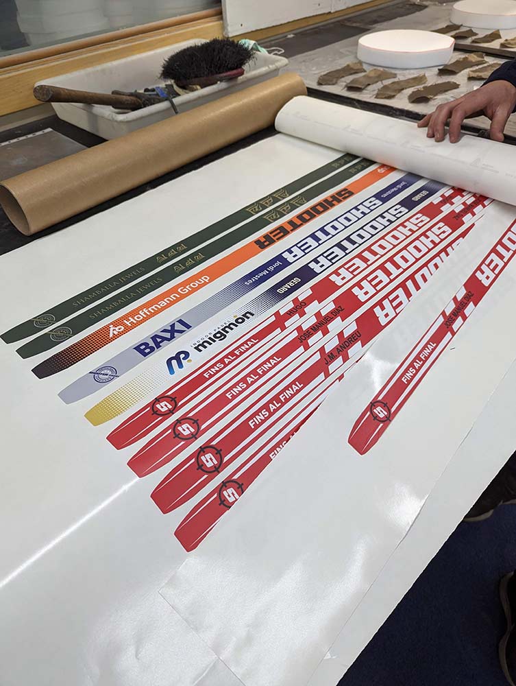 One of the founders showing two personalized racquets