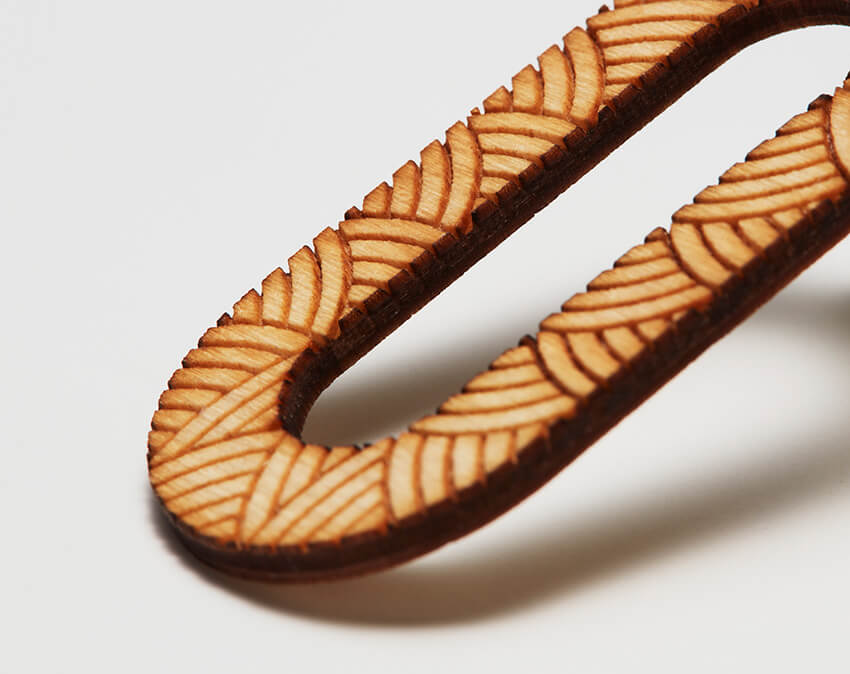 Precision Cutting and Engraving of LV Series - Close up of pierced Earring