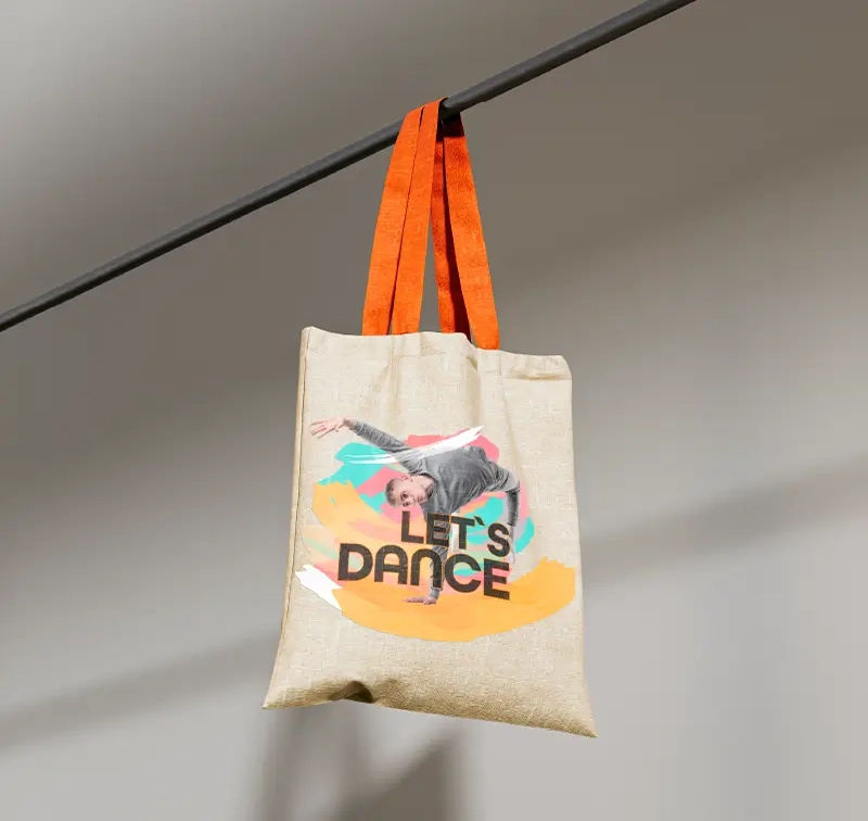 Tote bag with vibrant 'LET'S DANCE' design printed using Roland BN2 Series printer/cutter for high-quality results.